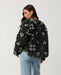 Rip Curl Bossa Nova Revo women’s reversible jacket in Military Green – back view of the black-and-cream patterned side