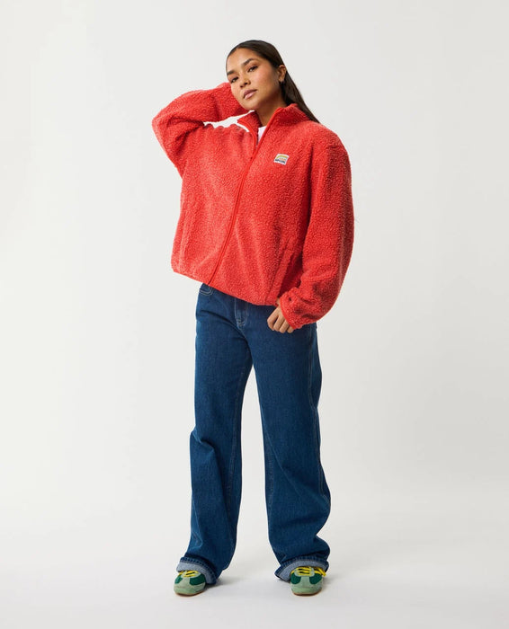 Rip Curl red zip-through polar fleece shown full length on model
