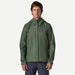 Patagonia Torrentshell 3L Rain Jacket in Canopy Green worn by a male model, front