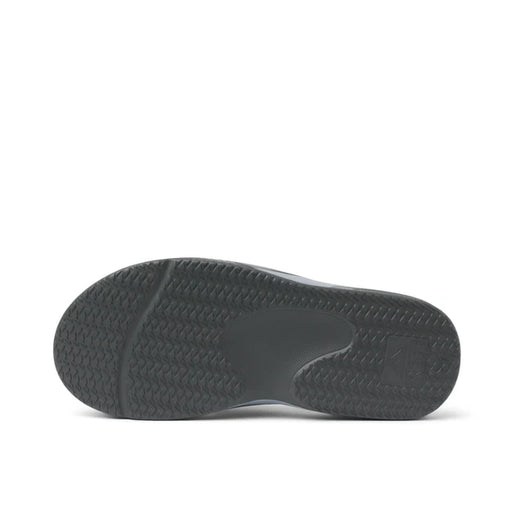 Black textured sole of watersports shoe with grip pattern