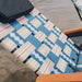 Parkit Eclipse Classic Blue chair in Enjoy recline position with ergonomic pillow and faux teak armrests visible