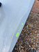 Used Duotone Jaime SLS 2027 kiteboard surface close-up showing faint sand scuffs