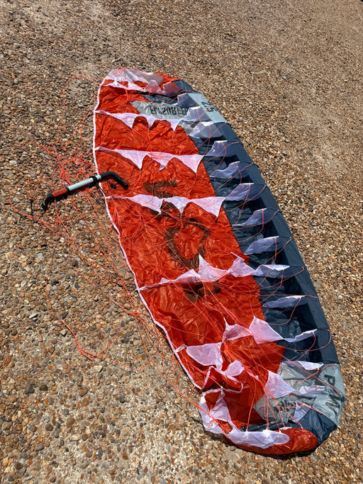 Flysurfer POW 2.5m single skin parawing underside on pebble beach — Board-Worx