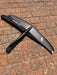 Overview of used F-one Eagle 990 HM Carbon wing foil showing top view with F-one lightning bolt logo and underside view on brick paving