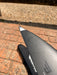Close-up of wingtip of used F-one Eagle 990 HM Carbon showing Eagle 990 text and slight surface scuffs on leading edge — disclosed cosmetic marks
