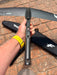 F-one Eagle 990 HM Carbon connection bar held up showing 3-hole Titan fitting and metallic fuselage adapter plate