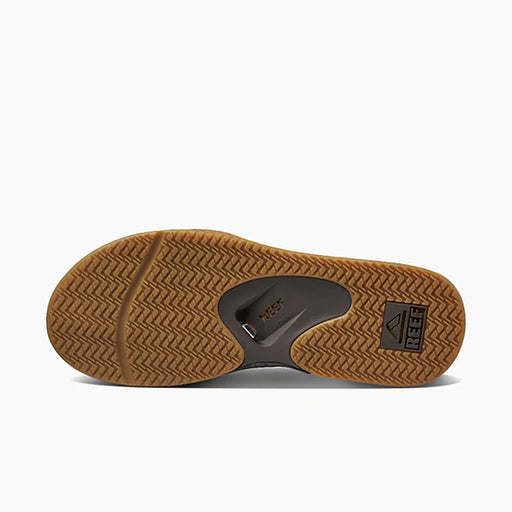 Reef sandal sole with brown tread and brand logo