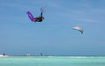 Duotone Jaime SLS 2027 during a freestyle aerial over turquoise water