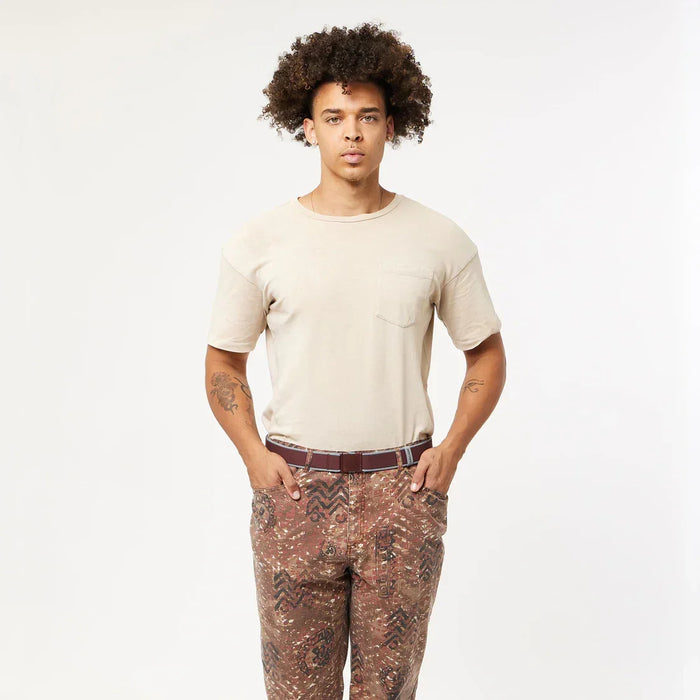 Arcade burgundy cloud belt on patterned trousers, casual surf clothing style.