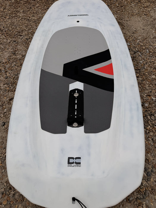 Close-up of footstrap mount and Dual Carbon Stringer System decal on used Armstrong 132L wing SUP board