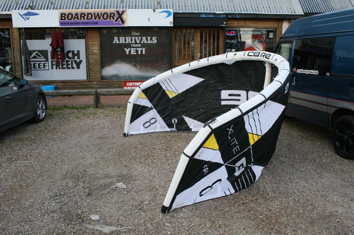 CORE XLITE hydrofoil kite for light wind kitesurfing, black and white, set up outdoors