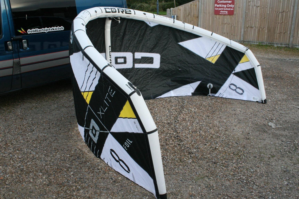 CORE XLITE 8m hydrofoil kite for light wind kitesurfing, black and white design outdoors