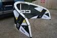 CORE XLITE 8m hydrofoil kite for light wind kitesurfing, black and white design outdoors