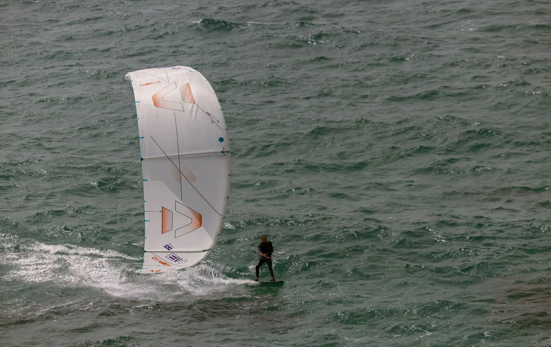 Duotone Evo SLS white kitesurfing kite in action on water with rider