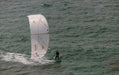 Duotone Evo SLS white kitesurfing kite in action on water with rider
