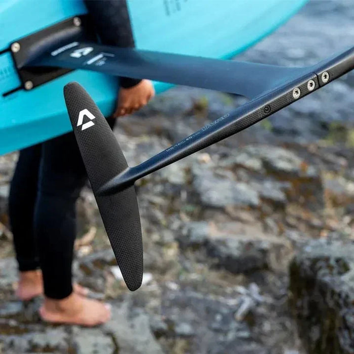 Duotone black hydrofoil monobloc tail on blue board, watersports gear outdoors
