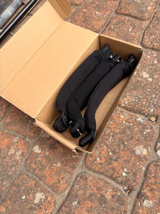 Three Duotone footstraps in original cardboard box included with the used Duotone Skybrid 100L 2025 wing foil board