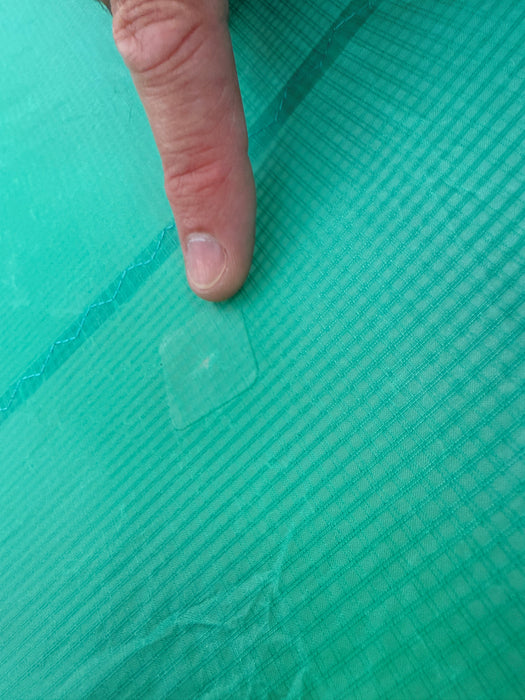The single tiny repaired nick on the Duotone Unit 3.5 canopy, a couple of mm