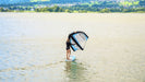 ENSIS inflatable windsurf wing and paddleboard SUP being used on open water