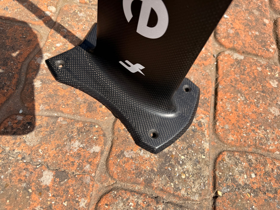 Top view of used F-one Carbon Mast 85 board foot connection showing F-one lightning bolt logo and 3-hole plate fitting