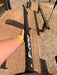 Full length side profile of used F-one Carbon Mast 85 held up showing clean carbon body with F-one branding and 85 size marking