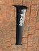 Used F-one Carbon Mast 85cm laid on brick paving showing full side profile with F-one branding and 85 size marking