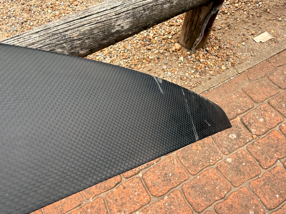 Close-up of leading edge area on used F-one Eagle 1290 HM Carbon showing small surface scratches — disclosed cosmetic marks, no structural damage