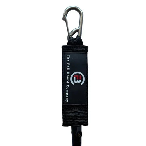 The Foil Board Company wing foil board leash with black padded strap and metal clip.