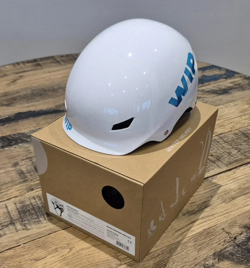 WIP white shiny watersports helmet with blue lettering, displayed on a box
