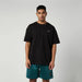 Mystic black profile tee for watersports, logo on chest, worn by male model