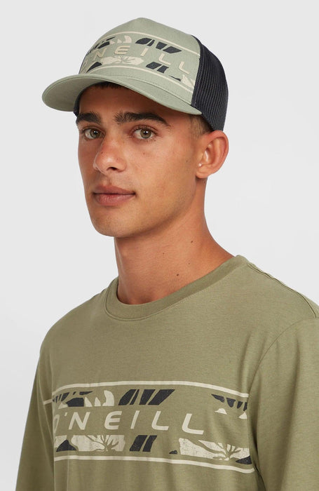 O'Neill green flower print trucker cap with mesh back, worn by model in matching t-shirt