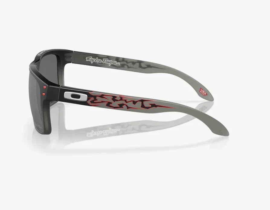 Oakley Holbrook sunglasses with black fade frame, Prizm black lenses, and red graphic arms