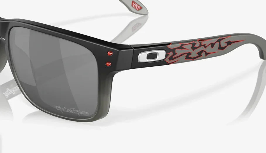 Oakley Holbrook sunglasses with Troy Lee Designs black fade frame, red graphic, Prizm black lenses