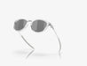 Oakley sunglasses with clear polished frame and black lenses, sports eyewear