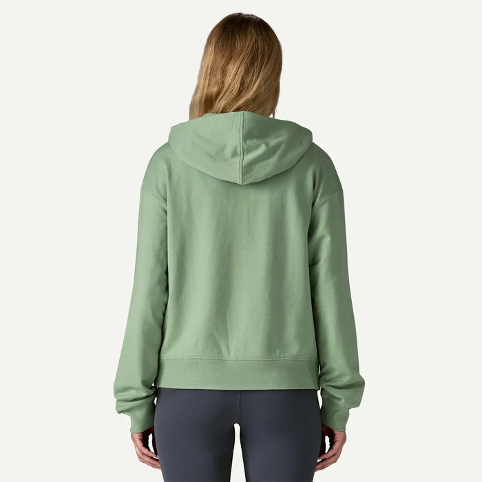 Woman wearing green Patagonia full zip hoodie, viewed from the back