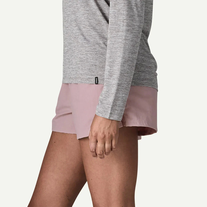 Patagonia Barely Baggies pink shorts for watersports, worn by person with grey top
