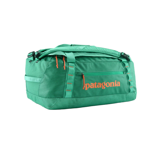 Green duffel bag with Patagonia logo on a white background