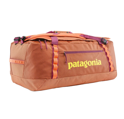 Orange and brown duffel bag with Patagonia logo on a white background