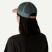 Patagonia P-6 Logo trucker hat with peach brim and grey mesh back, shown from behind