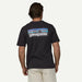 Man wearing black Patagonia logo surf t-shirt, ideal for watersports and beachwear