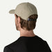 Patagonia Terrebonne khaki cap with adjustable strap, worn by man in black shirt