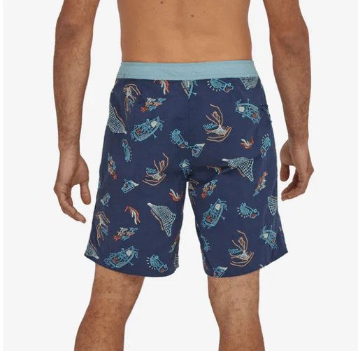 Blue patterned board shorts with watersports graphics, ideal for beachwear at Boardworx Whitstable.