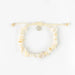 Natural shell bracelet set with cream adjustable cord and metallic charm