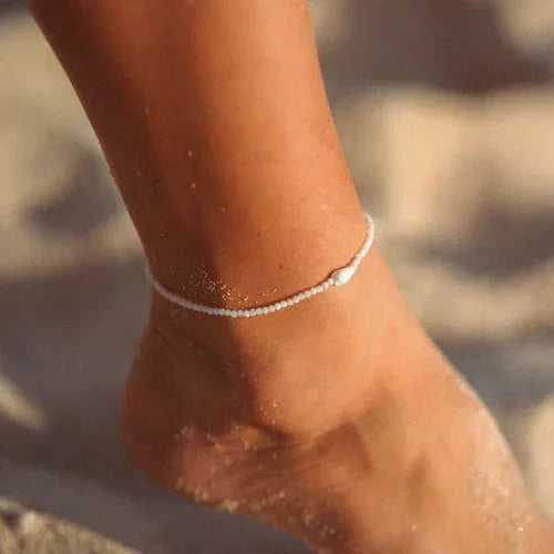 Pineapple Island Giada Melati shell beaded anklet, white, worn on ankle at the beach