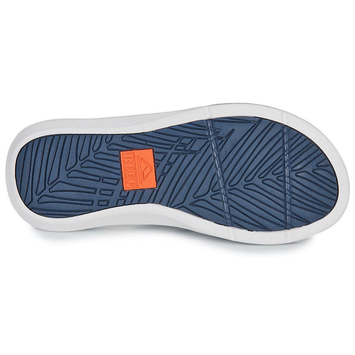 Reef flip flop sole in blue with orange logo, textured for grip, ideal for watersports.