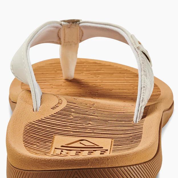 Reef Santa Ana flip flop with tan sole and white strap, close-up view