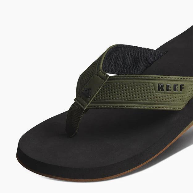 Reef Layback flip flops in black and olive with textured strap, surf clothing footwear