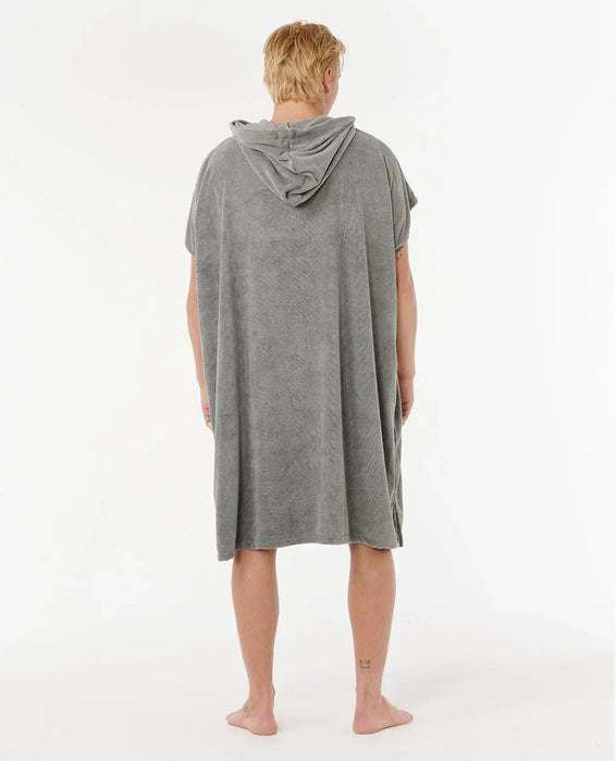 Rip Curl olive hooded towel poncho for watersports, shown on person from the back.
