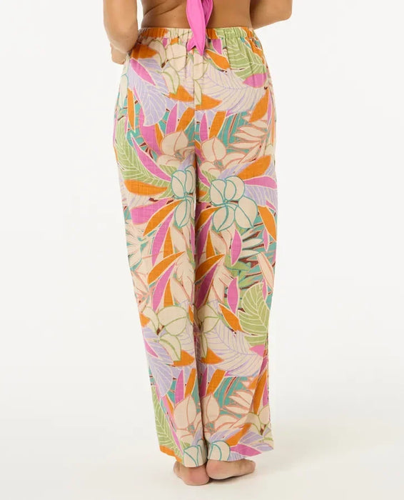 Rip Curl Cala Vadella pants with tropical floral print in pink, orange, and green
