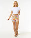 Rip Curl women's floral print board shorts with drawstring, beachwear, model standing